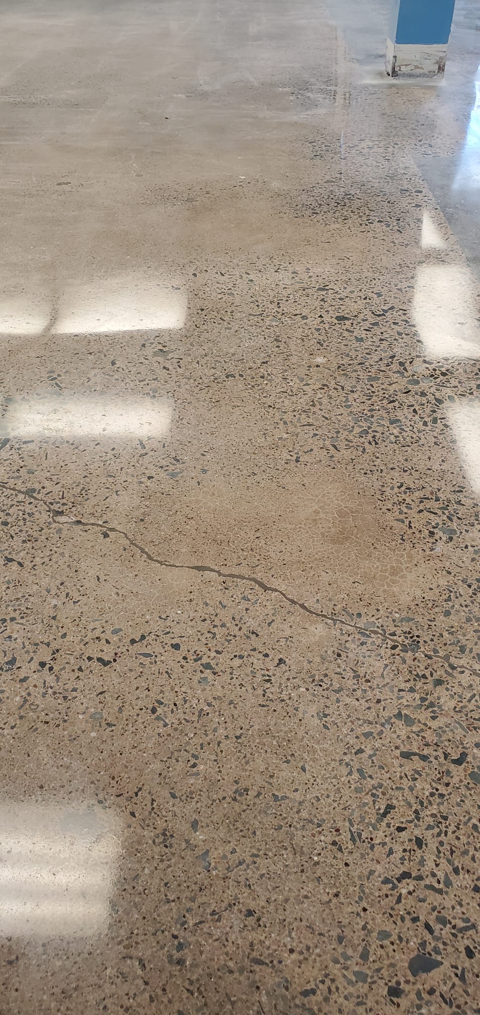 Protective moisture-resistant concrete sealing for a basement floor in Dartmouth.